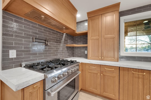 kitchen featuring tasteful backsplash, high end stainless steel range oven, recessed lighting, open shelves, and light stone countertops