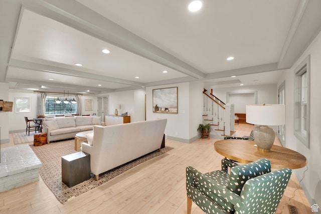 living room with baseboards, recessed lighting, beamed ceiling, wood finished floors, and stairway