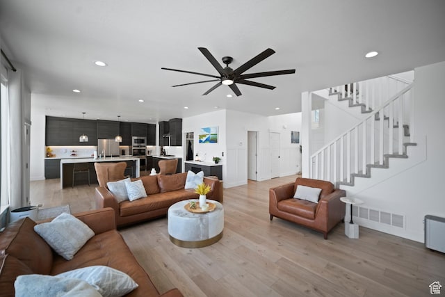 2848 S Preening Way, Saratoga Springs, UT 84045 - living room with a ceiling fan, light wood-style floors, stairs, and recessed lighting