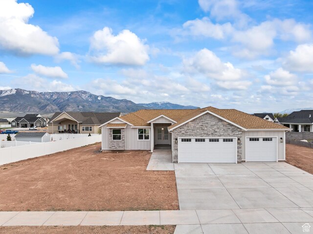 949 W Torrey Pines Dr, Richfield, UT 84701 - ranch-style house with an attached garage, fence, driveway, and a mountain view