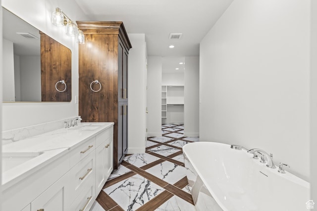 949 W Torrey Pines Dr, Richfield, UT 84701 - full bath featuring marble finish floor, a soaking tub, baseboards, visible vents, and recessed lighting