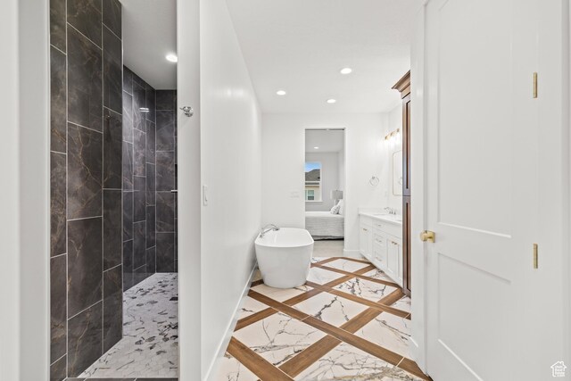 949 W Torrey Pines Dr, Richfield, UT 84701 - bathroom with marble finish floor, a freestanding bath, a walk in shower, and recessed lighting