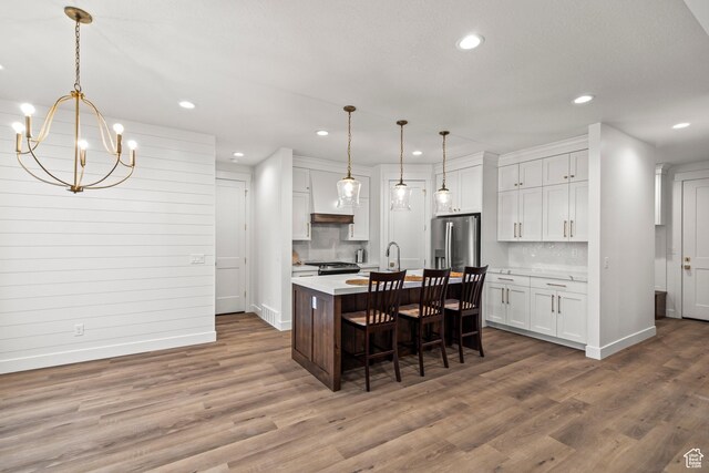 949 W Torrey Pines Dr, Richfield, UT 84701 - kitchen with light countertops, appliances with stainless steel finishes, baseboards, and white cabinets