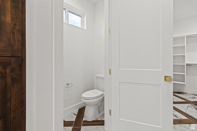 949 W Torrey Pines Dr, Richfield, UT 84701 - bathroom featuring baseboards, marble finish floor, and toilet