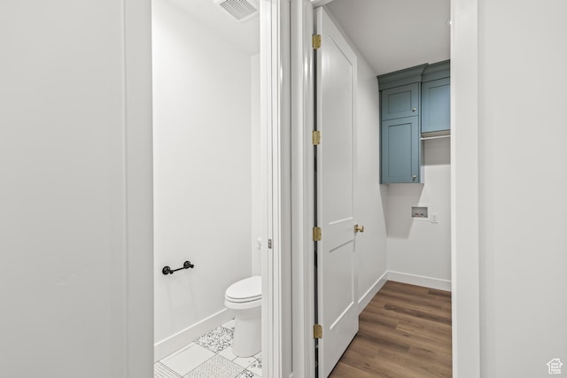 949 W Torrey Pines Dr, Richfield, UT 84701 - bathroom with wood finished floors, visible vents, toilet, and baseboards
