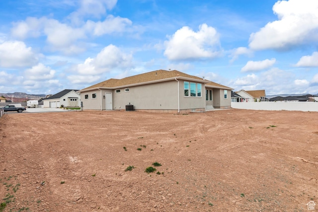 949 W Torrey Pines Dr, Richfield, UT 84701 - back of property with fence, a residential view, cooling unit, and stucco siding