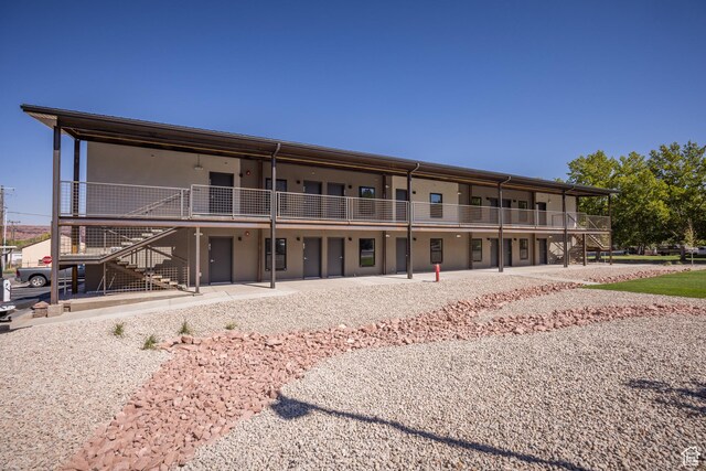 443 W Kane Creek Blvd Unit A206, Moab, UT 84532 - back of house featuring stairway and a patio