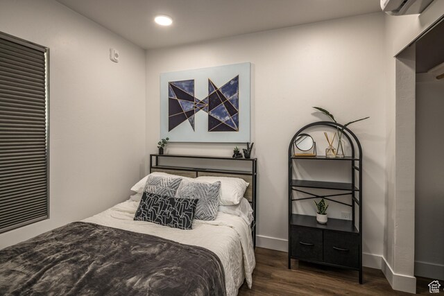 443 W Kane Creek Blvd Unit A206, Moab, UT 84532 - bedroom with recessed lighting, wood finished floors, baseboards, and a wall mounted air conditioner