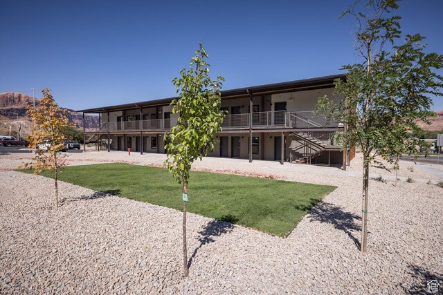443 W Kane Creek Blvd Unit A206, Moab, UT 84532 - surrounding community featuring a lawn and stairway
