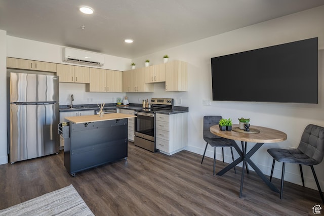 443 W Kane Creek Blvd Unit A206, Moab, UT 84532 - kitchen featuring light brown cabinets, an AC wall unit, butcher block countertops, stainless steel appliances, and dark wood-type flooring