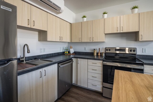 443 W Kane Creek Blvd Unit A206, Moab, UT 84532 - kitchen featuring dark wood finished floors, light brown cabinetry, appliances with stainless steel finishes, and a sink
