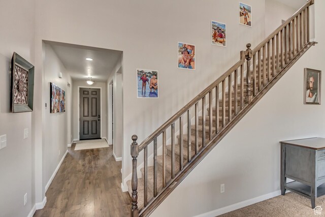 interior space featuring stairway, baseboards, and wood finished floors