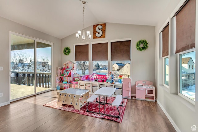 sunroom / solarium featuring a chandelier