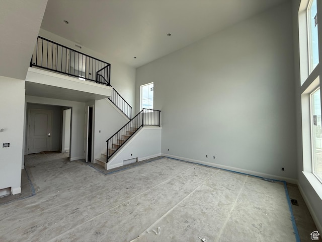 89 N 2430 W Unit 4, Lehi, UT 84043 - unfurnished living room with a towering ceiling and stairs