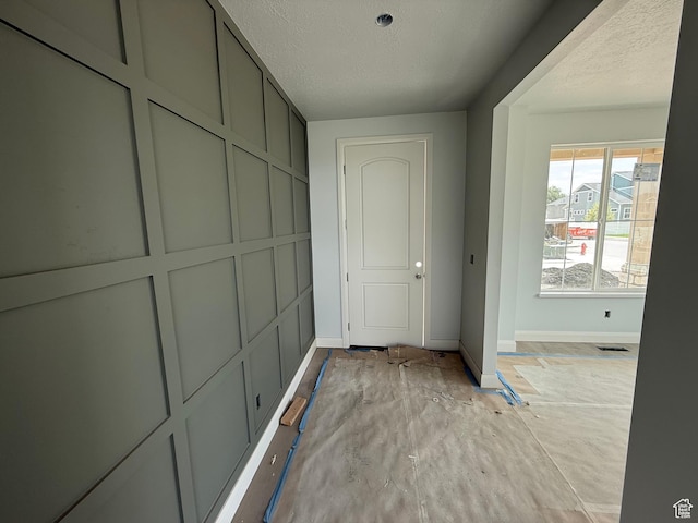 89 N 2430 W Unit 4, Lehi, UT 84043 - hall featuring baseboards and a textured ceiling