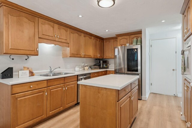 374 S Fairlane, Tooele, UT 84074 - kitchen featuring light countertops, light wood finished floors, stainless steel appliances, and a sink