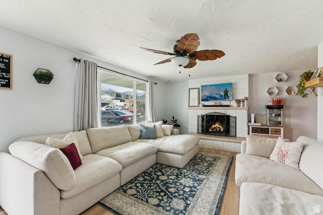 374 S Fairlane, Tooele, UT 84074 - living area featuring wood finished floors, a brick fireplace, and ceiling fan