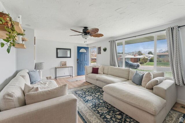 374 S Fairlane, Tooele, UT 84074 - living room featuring light wood-style flooring, baseboards, and ceiling fan