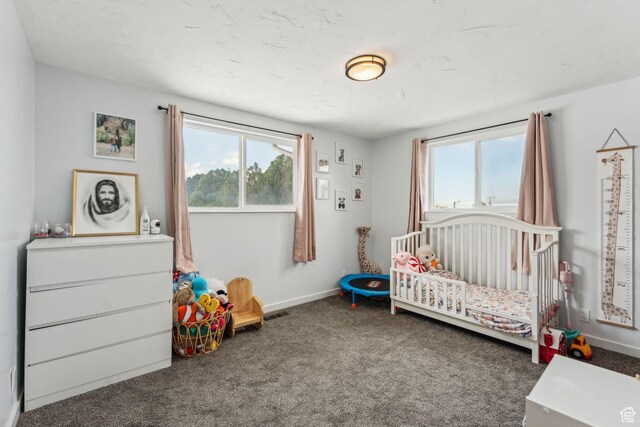 374 S Fairlane, Tooele, UT 84074 - bedroom with a nursery area, baseboards, and carpet flooring
