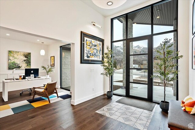 655 Wilard Peak Rd, Mantua, UT 84324 - entryway with recessed lighting, a towering ceiling, wood finished floors, and baseboards