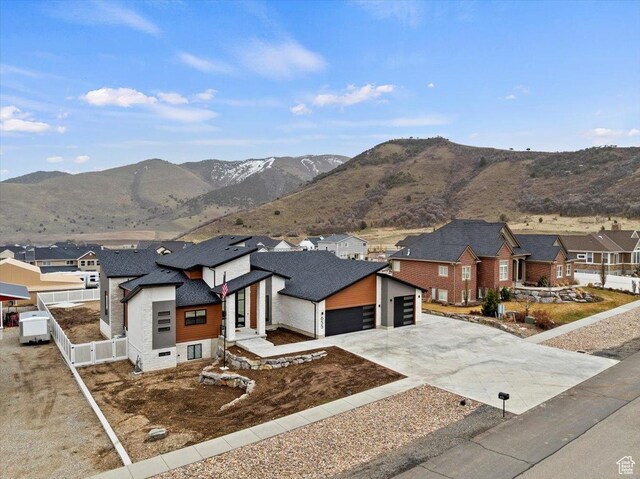 655 Wilard Peak Rd, Mantua, UT 84324 - view of front of property with fence, driveway, a mountain view, and a residential view