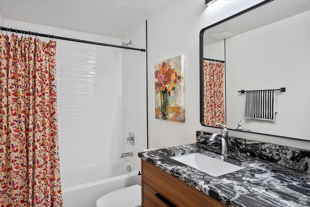 655 Wilard Peak Rd, Mantua, UT 84324 - bathroom featuring shower / bath combo, vanity, a textured ceiling, and toilet