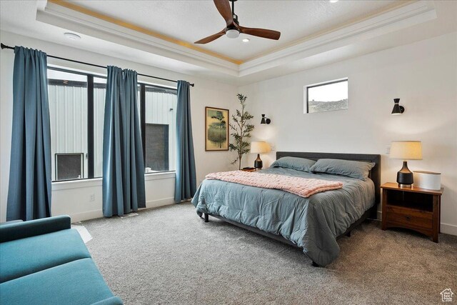 655 Wilard Peak Rd, Mantua, UT 84324 - carpeted bedroom featuring baseboards, a ceiling fan, a tray ceiling, and ornamental molding