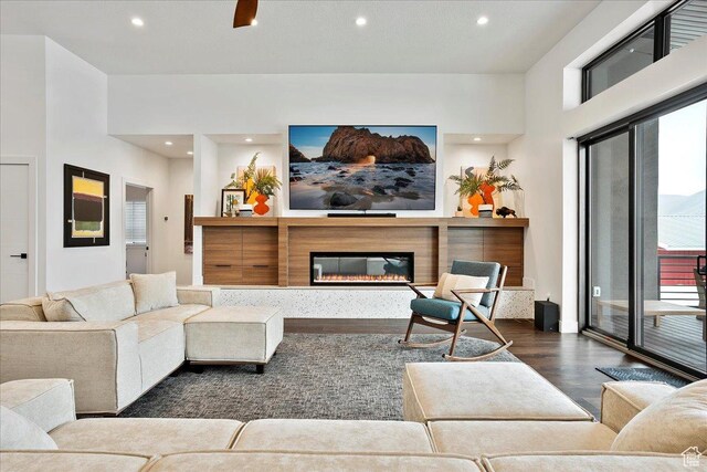 655 Wilard Peak Rd, Mantua, UT 84324 - living area featuring a glass covered fireplace, recessed lighting, and dark wood-type flooring