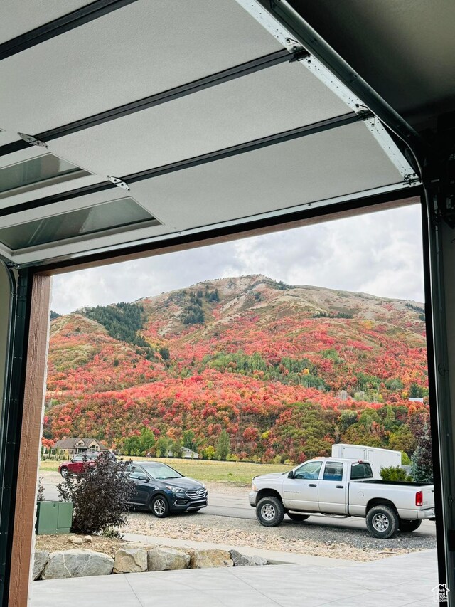 655 Wilard Peak Rd, Mantua, UT 84324 - garage featuring a mountain view and a view of trees