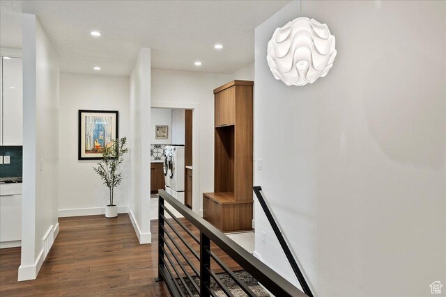 655 Wilard Peak Rd, Mantua, UT 84324 - hall with washing machine and clothes dryer, an upstairs landing, baseboards, dark wood-style flooring, and recessed lighting