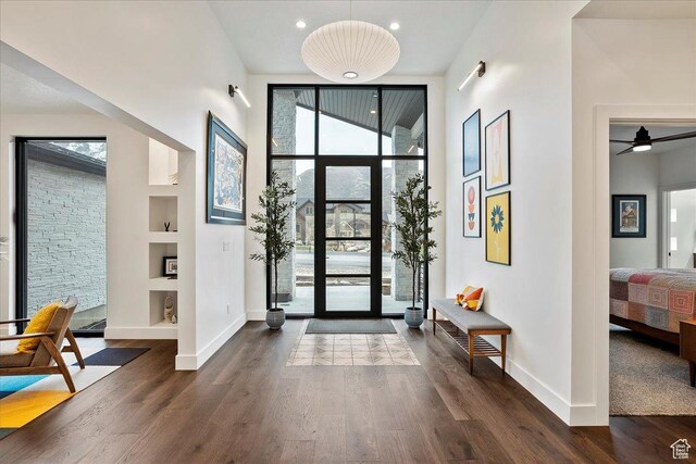 655 Wilard Peak Rd, Mantua, UT 84324 - entryway with a towering ceiling, baseboards, recessed lighting, and dark wood-style flooring