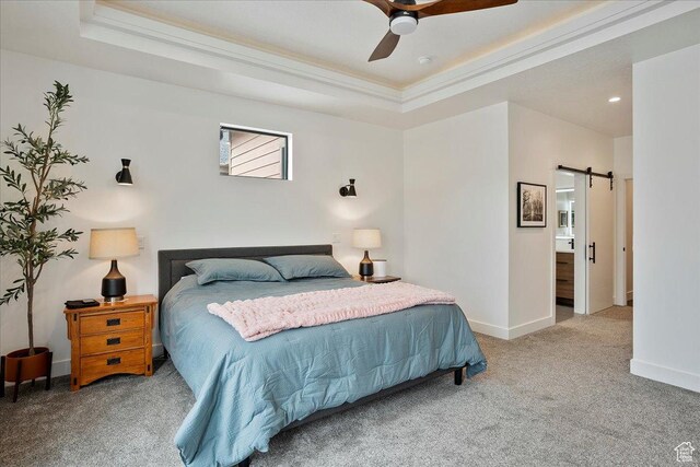 655 Wilard Peak Rd, Mantua, UT 84324 - carpeted bedroom with a barn door, baseboards, crown molding, and a tray ceiling