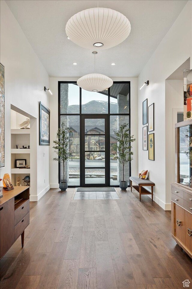 655 Wilard Peak Rd, Mantua, UT 84324 - foyer featuring recessed lighting, expansive windows, wood finished floors, and baseboards