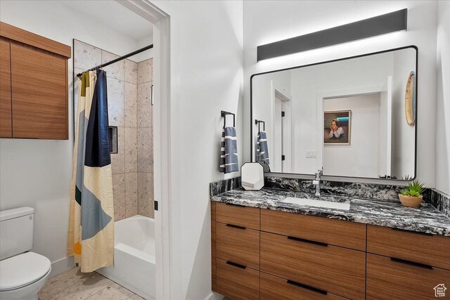 655 Wilard Peak Rd, Mantua, UT 84324 - full bathroom with baseboards, toilet, vanity, and shower / bath combination with curtain