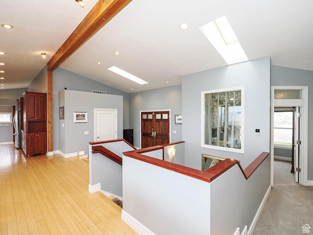 1022 E Northbonneville Dr N, Salt Lake City, UT 84103 - hallway featuring a skylight, an upstairs landing, baseboards, recessed lighting, and light wood-style floors