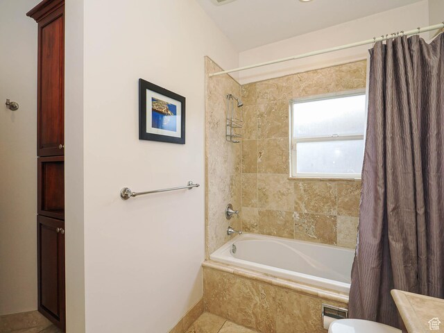 1022 E Northbonneville Dr N, Salt Lake City, UT 84103 - bathroom with shower / bath combo, baseboards, and tile patterned flooring