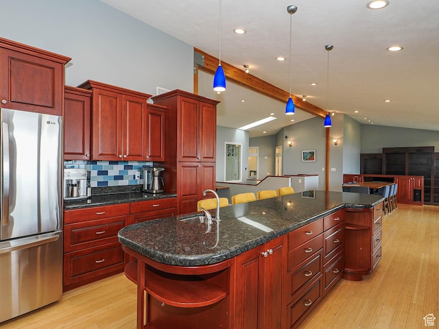 1022 E Northbonneville Dr N, Salt Lake City, UT 84103 - kitchen featuring freestanding refrigerator, open shelves, dark brown cabinets, a sink, and light wood finished floors