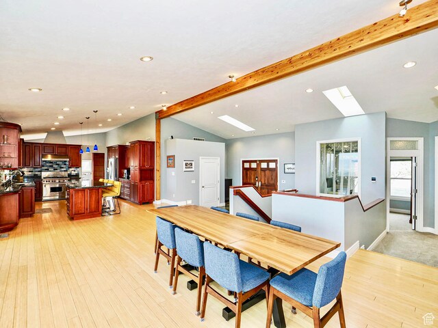 1022 E Northbonneville Dr N, Salt Lake City, UT 84103 - dining space with a skylight, recessed lighting, light wood-style floors, and baseboards