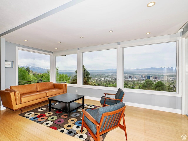 1022 E Northbonneville Dr N, Salt Lake City, UT 84103 - sunroom featuring wood finished floors, baseboards, recessed lighting, and a mountain view