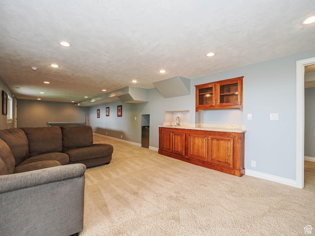 1022 E Northbonneville Dr N, Salt Lake City, UT 84103 - living room with recessed lighting, light carpet, baseboards, and bar with sink