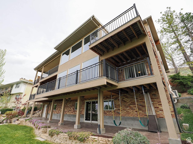 1022 E Northbonneville Dr N, Salt Lake City, UT 84103 - rear view of house featuring brick siding and a balcony