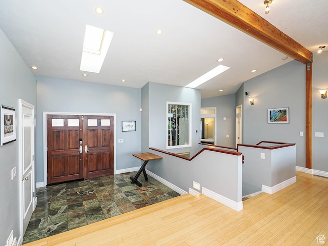 1022 E Northbonneville Dr N, Salt Lake City, UT 84103 - foyer entrance featuring a skylight, recessed lighting, beamed ceiling, baseboards, and wood finished floors