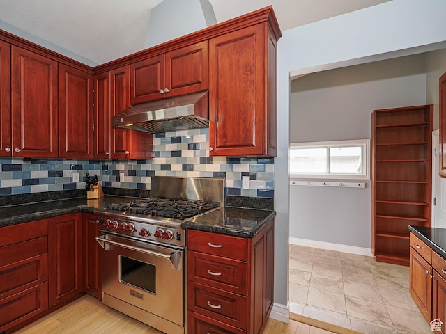 1022 E Northbonneville Dr N, Salt Lake City, UT 84103 - kitchen featuring luxury range, under cabinet range hood, dark brown cabinets, and baseboards