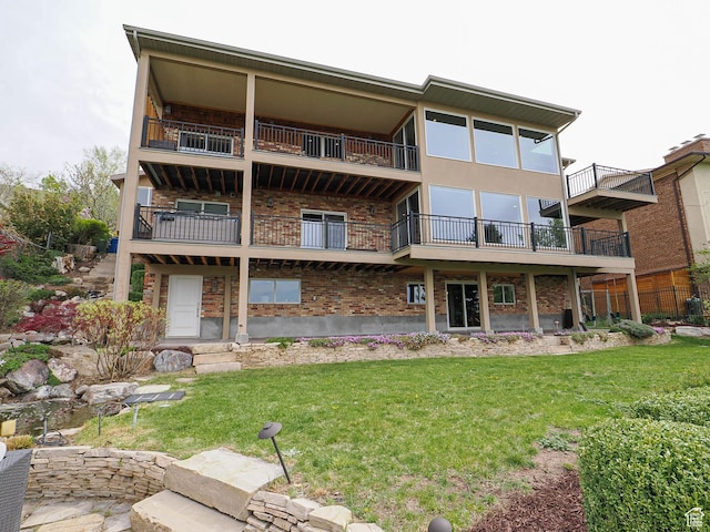 1022 E Northbonneville Dr N, Salt Lake City, UT 84103 - back of house featuring a yard and brick siding