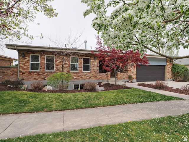 1022 E Northbonneville Dr N, Salt Lake City, UT 84103 - view of front of property with concrete driveway, brick siding, and an attached garage