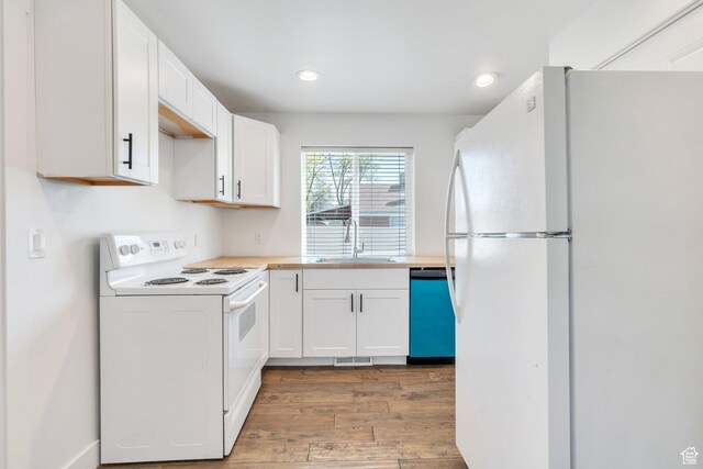 1001 S 400 E, Orem, UT 84097 - kitchen featuring white cabinets, wood finished floors, a sink, and white appliances