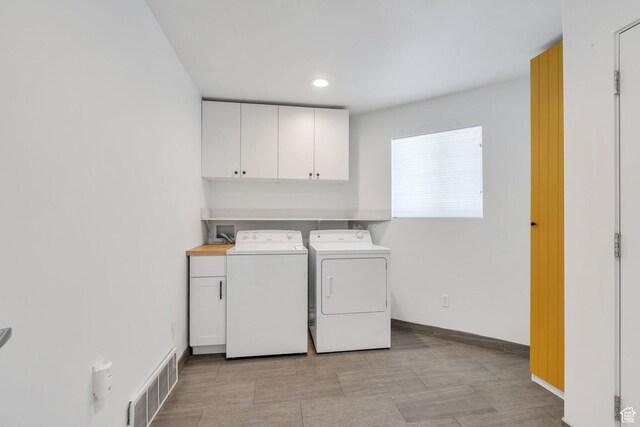1001 S 400 E, Orem, UT 84097 - clothes washing area with washing machine and dryer, baseboards, visible vents, recessed lighting, and cabinet space
