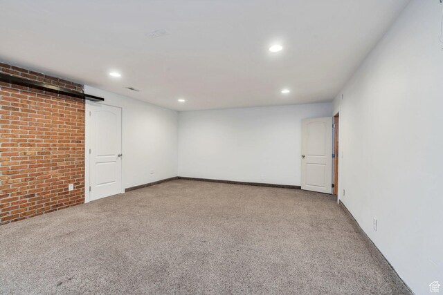 1001 S 400 E, Orem, UT 84097 - empty room featuring recessed lighting, carpet, baseboards, and brick wall