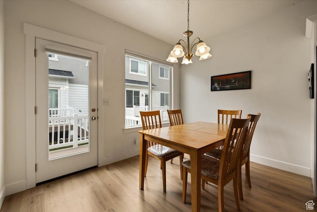 269 W 590 N, Vineyard, UT 84059 - dining space featuring light wood finished floors, baseboards, an inviting chandelier, and a healthy amount of sunlight