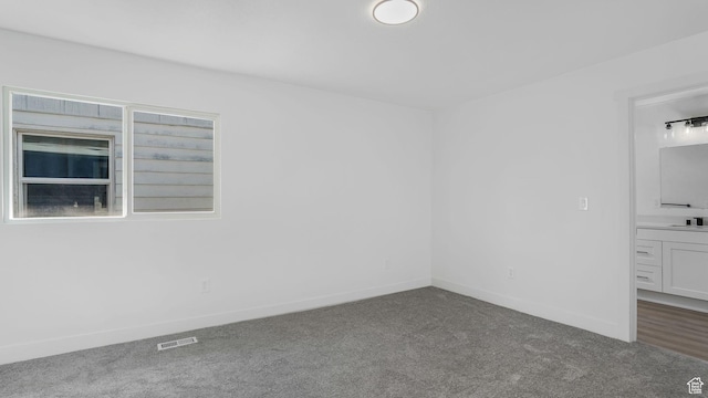 557 N 1200 W, Salt Lake City, UT 84116 - carpeted empty room with visible vents, baseboards, and a sink